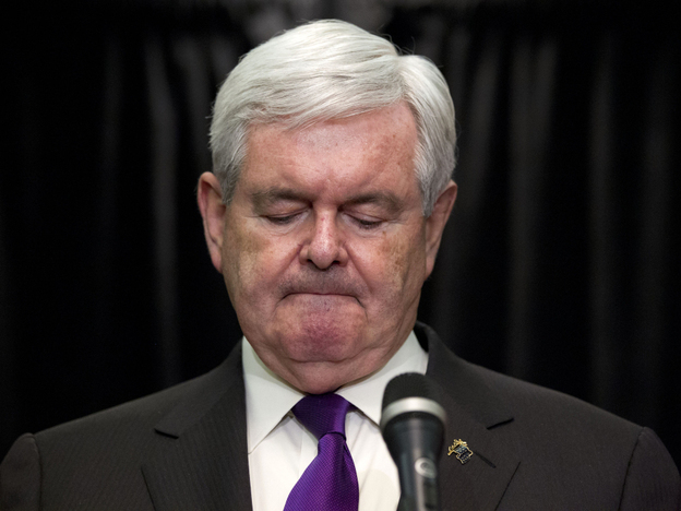 Former House Speaker Newt Gingrich pauses while announcing that he is suspending his presidential campaign Wednesday in Arlington, Va.