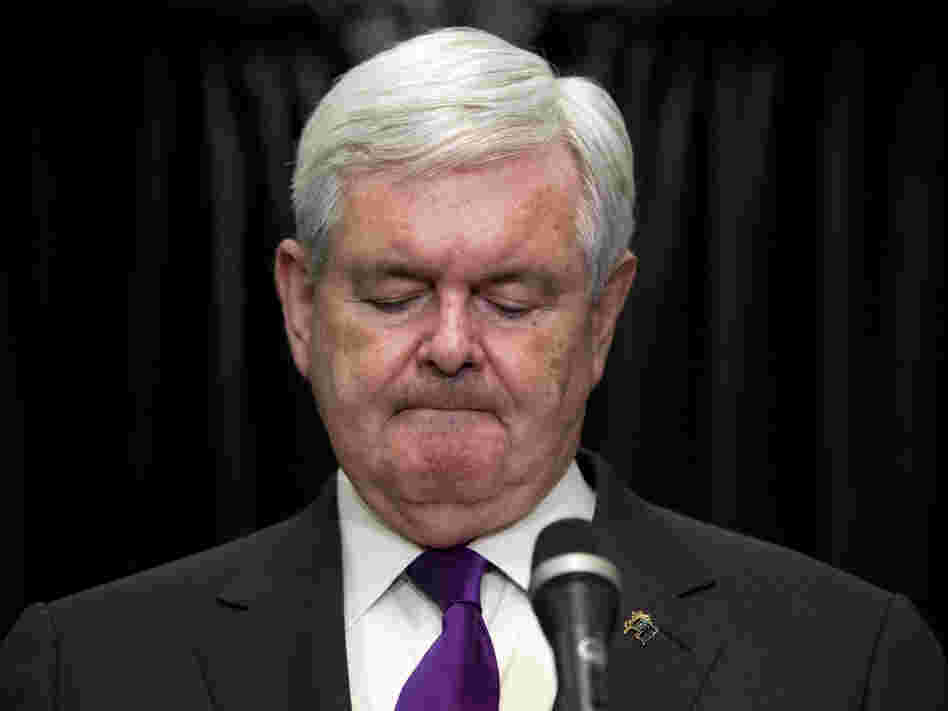 Former House Speaker Newt Gingrich pauses while announcing that he is suspending his presidential campaign Wednesday in Arlington, Va.