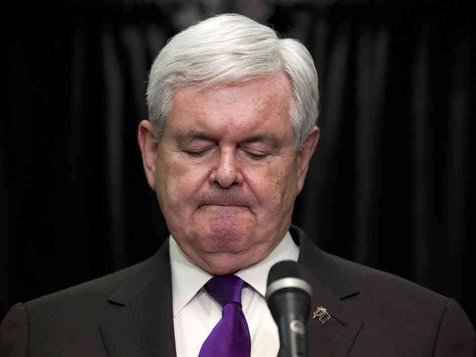 Former House Speaker Newt Gingrich pauses while announcing that he is suspending his presidential campaign Wednesday in Arlington, Va.
