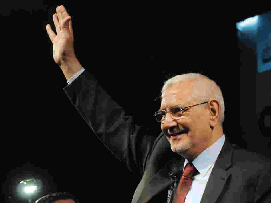 Egyptian former Muslim Brotherhood senior member and now independent presidential candidate Abdel Moneim Abol Fotouh gestures to the crowd on stage during his election campaign rally on April 2, 2012, at the Azhar park in Cairo.