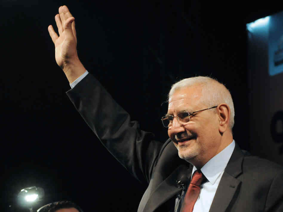 Egyptian former Muslim Brotherhood senior member and now independent presidential candidate Abdel Moneim Abol Fotouh gestures to the crowd on stage during his election campaign rally on April 2, 2012, at the Azhar park in Cairo.