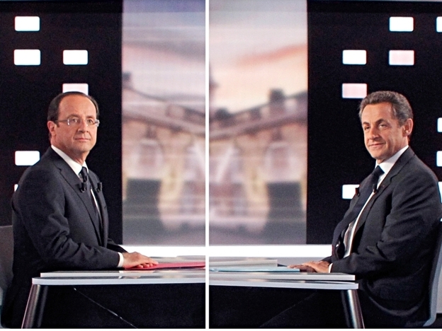 Socialist Francois Hollande, (left) and France's incumbent president, Nicolas Sarkozy, pose for photos before facing off during a contentious debate Wednesday on national TV. Opinion polls favor Hollande heading into Sunday's election.