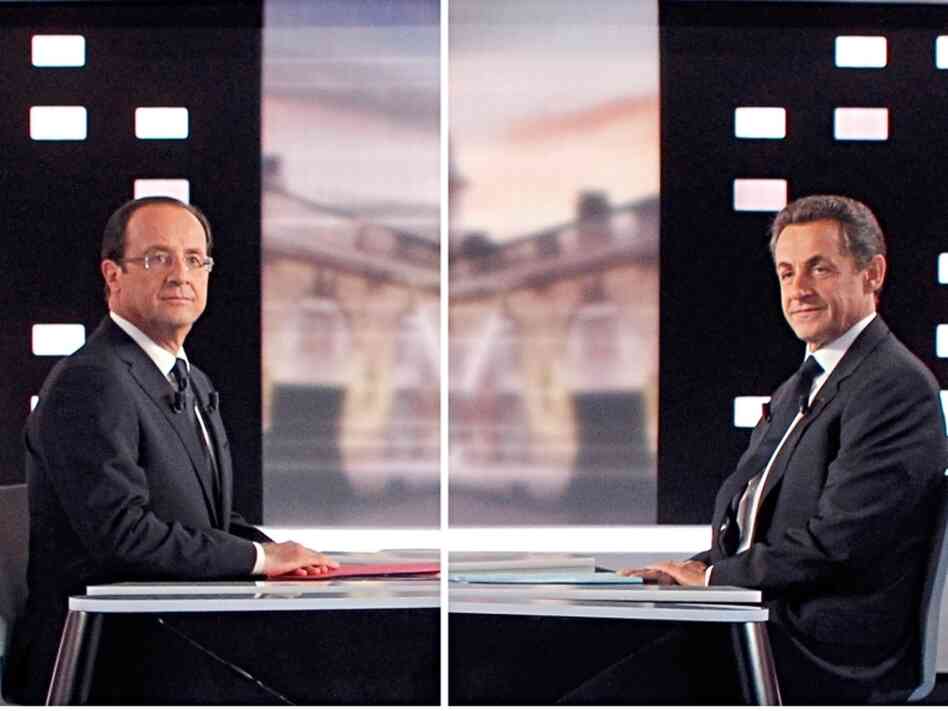 Socialist Francois Hollande, (left) and France's incumbent president, Nicolas Sarkozy, pose for photos before facing off during a contentious debate Wednesday on national TV. Opinion polls favor Hollande heading into Sunday's election.