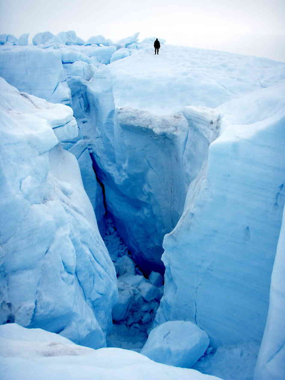 Rivers drop into deep holes called moulins. Once the water reaches the bedrock, it lubricates the underside of ice sheets, so they move faster. 