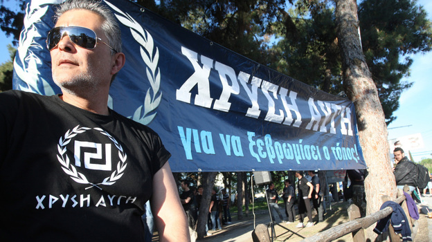 A member of the Golden Dawn far-right political organization takes part in a demonstration in Peraia, a suburb outside Thessaloniki, on April 26. Some polls indicate that in the national elections May 6, Golden Dawn may surpass the 3 percent threshold needed to enter Parliament. A member of the Golden Dawn far-right political organization takes part in a demonstration in Peraia, a suburb outside Thessaloniki, on April 26. Some polls indicate that in the national elections May 6, Golden Dawn may surpass the 3 percent threshold needed to enter Parliament.
