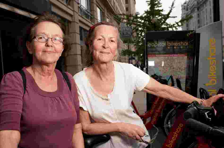 Sisters Bia and Cia Rosenquist are from Finland and Belgium, where helmetless riding is common. "We bike very carefully," Bia says. "We were riding more slowly because we don't know the city."