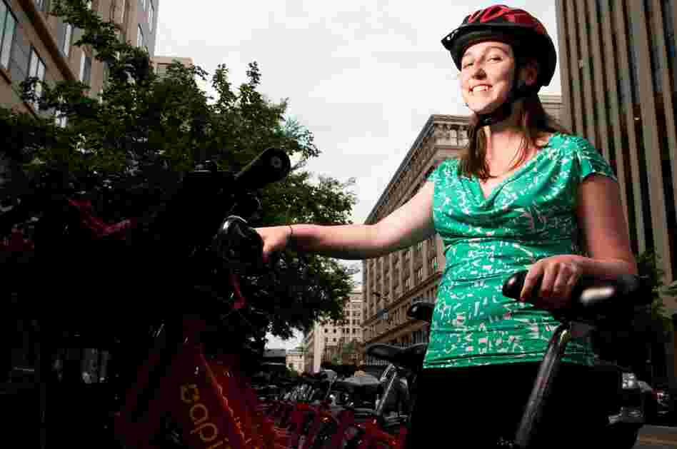 Kay McLaughlin, an editorial coordinator, sports a Capital Bikeshare-branded helmet. "This is my D.C. helmet. I keep it on top of my desk," she says. She has a second helmet for riding at home.