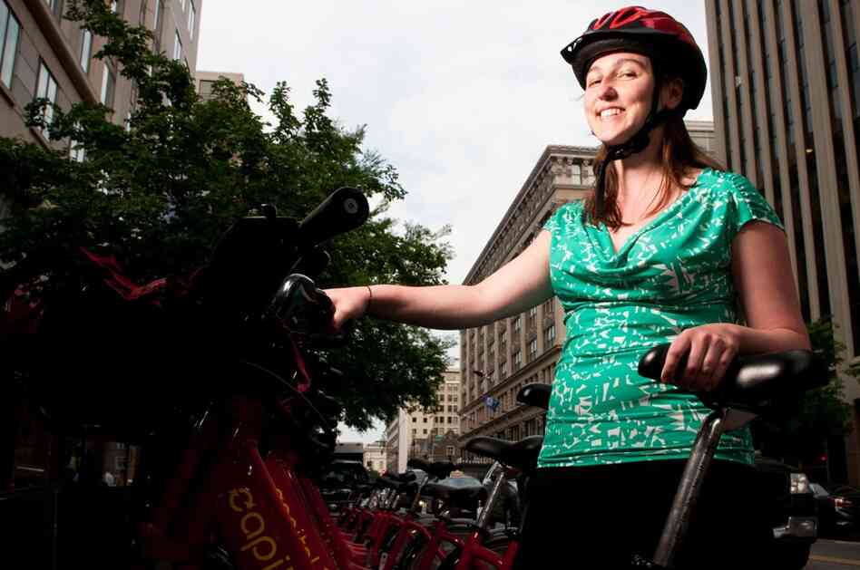 Kay McLaughlin, an editorial coordinator, sports a Capital Bikeshare-branded helmet. "This is my D.C. helmet. I keep it on top of my desk," she says. She has a second helmet for riding at home.