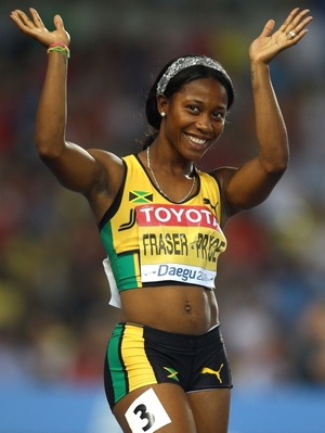 Shelly-Ann Fraser-Pryce waves after competing in the 100-meter semifinal at the World Athletics Championships in South Korea last year. Fraser-Pryce won gold at the 2008 Olympics, and is viewed as a hero by the Jamaican children she sometimes shares a track with. Shelly-Ann Fraser-Pryce waves after competing in the 100-meter semifinal at the World Athletics Championships in South Korea last year. Fraser-Pryce won gold at the 2008 Olympics, and is viewed as a hero by the Jamaican children she sometimes shares a track with.