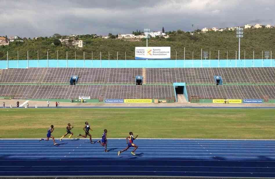 Jamaican teens and preteens compete in the island's track championships at the National Stadium in the capital, Kingston.
