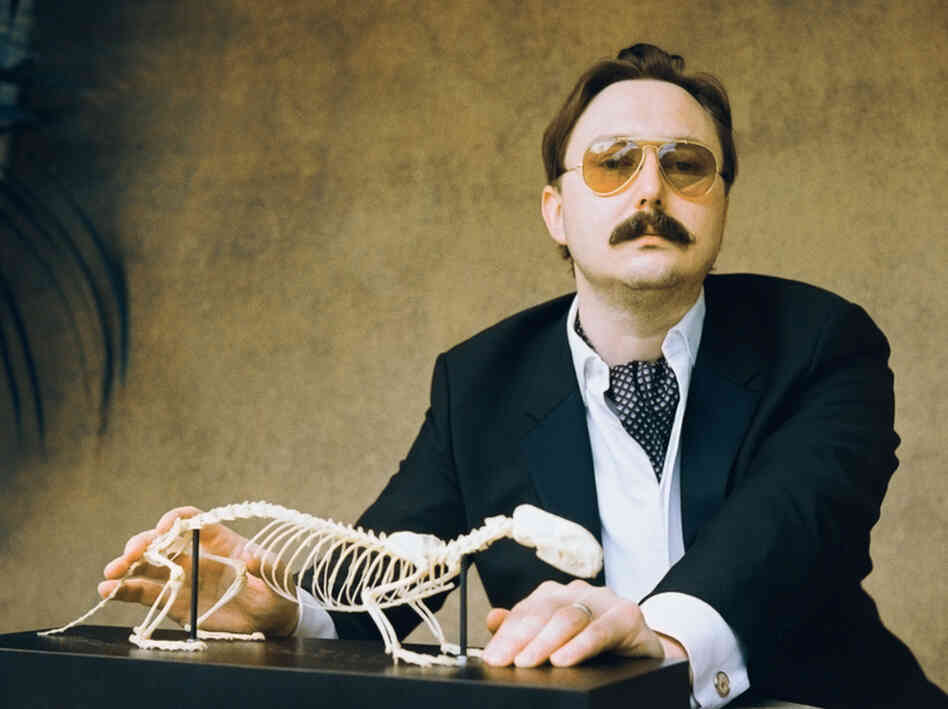 "I could be wrong, you know:" John Hodgman notes that while his book That Is All is intensely concerned with "the coming global superpocalypse," it also contains much information about travel and sports and wine, and is "not depressing."