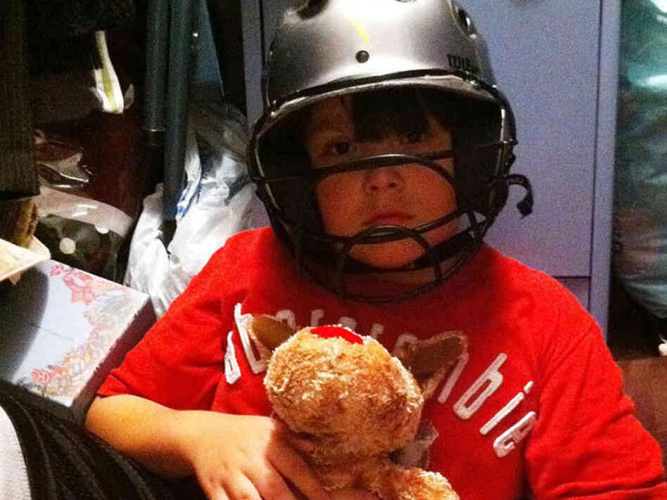 Noah Stewart shelters in the closet just 15 minutes before an April 2011 tornado demolished his house. Wearing the helmet may have saved his life, one doctor says.