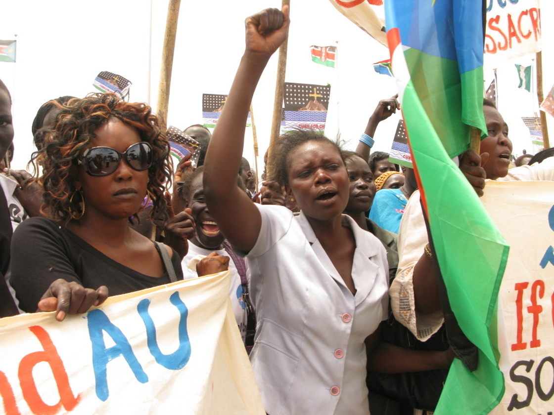 Student Gloria Emmanuel (center) speaks for many South Sudanese who claim Sudan, and its president, Omar Hassan Al Bashir, have declared war on the South.