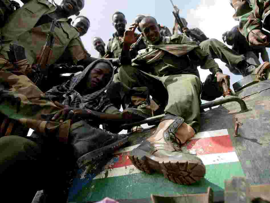 Sudanese soldiers step on the South Sudan flag painted on a seized tank for the Sudanese Peoples Liberation Army in Heglig last month.