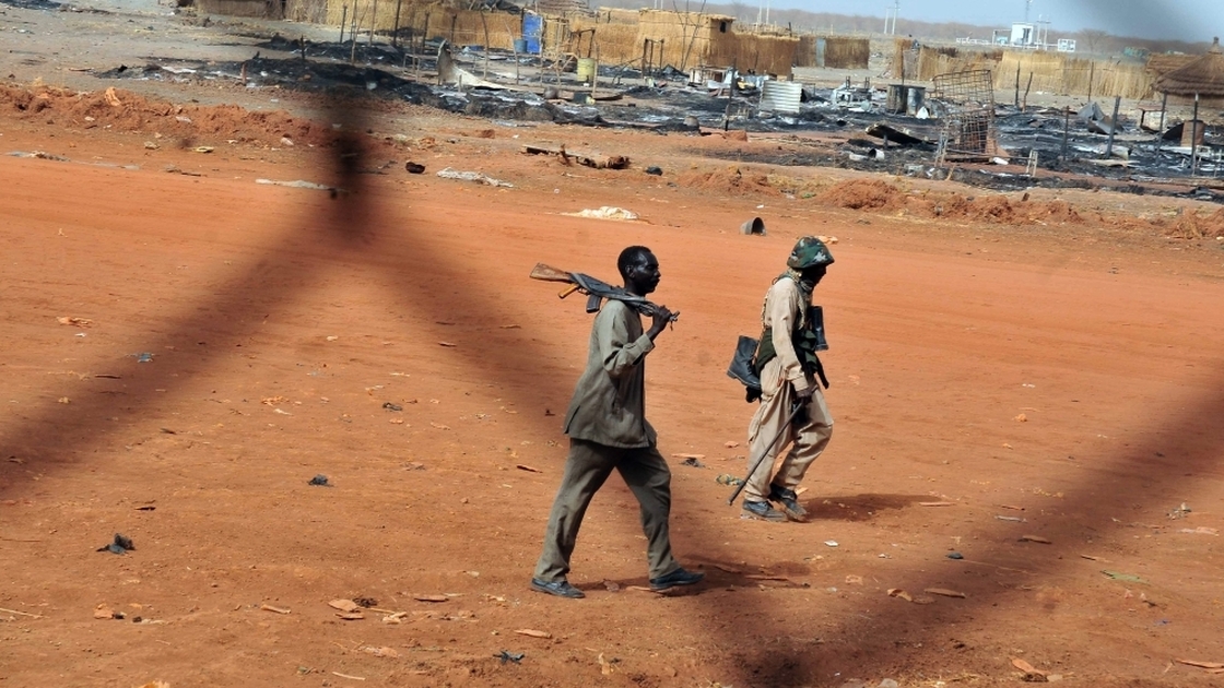 Sudanese soldiers walk in the oil town of Heglig on April 24. South Sudanese forces occupied Heglig last month. The international community called on the South to pull out, which it says it did.