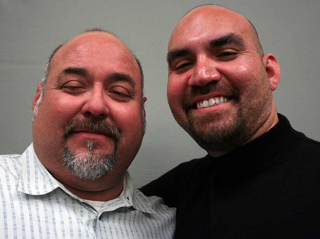 Ricardo Isaias Zavala (left) talked about his grandfather Vicente Domingo Villa with his son, Ricardo Javier Zavala, at StoryCorps in Austin, Texas.