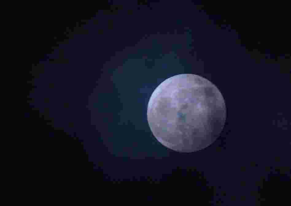 The moon hangs over Chevy Chase, Md., Saturday night. 