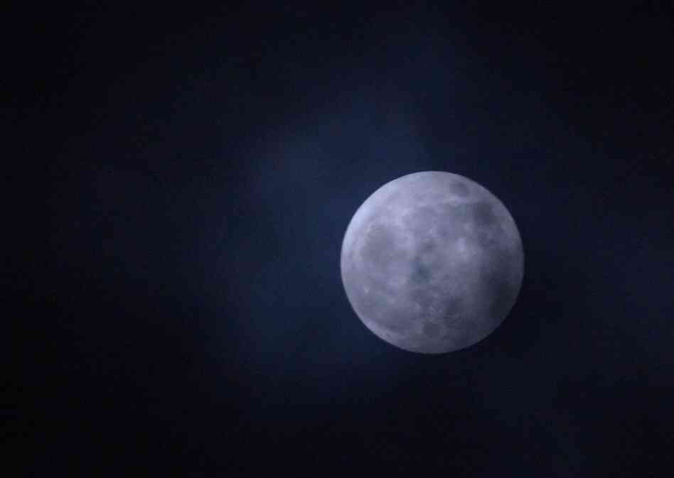 The moon hangs over Chevy Chase, Md., Saturday night. 