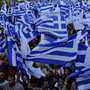 Supporters of the right-wing splinter Independent Greeks party wave flags during an election rally in the northern Greek city of Thessaloniki,  May 2, 2012. Panos Kammenos' party and other anti-bailout parties have made a strong showing in opinion polls ahead of the May 6 general election.