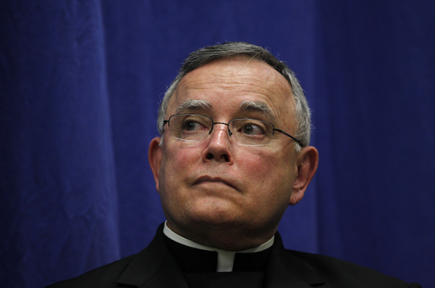Archbishop of Philadelphia Charles Chaput listens during a news conference on Friday in Philadelphia.