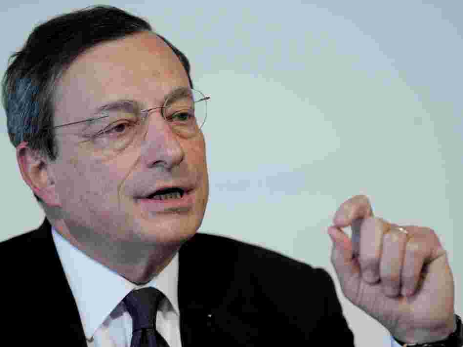 European Central Bank President Mario Draghi speaks at a news conference in Barcelona on Thursday. Central bank chiefs gathered under tight security in Spain to discuss whether to provide more easy money for governments as the political resolve to rein in deficits showed signs of crumbling.