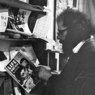 Allen Ginsberg browses at the Peace Eye bookstore.
