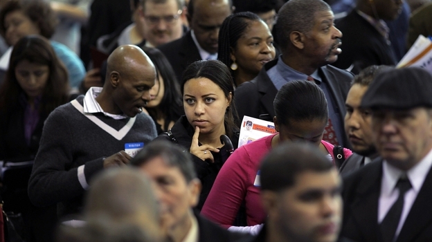 People wait at a job fair in New York City's Queens borough on Thursday. While millions of out-of-work Americans continue to seek employment, others have given up looking.