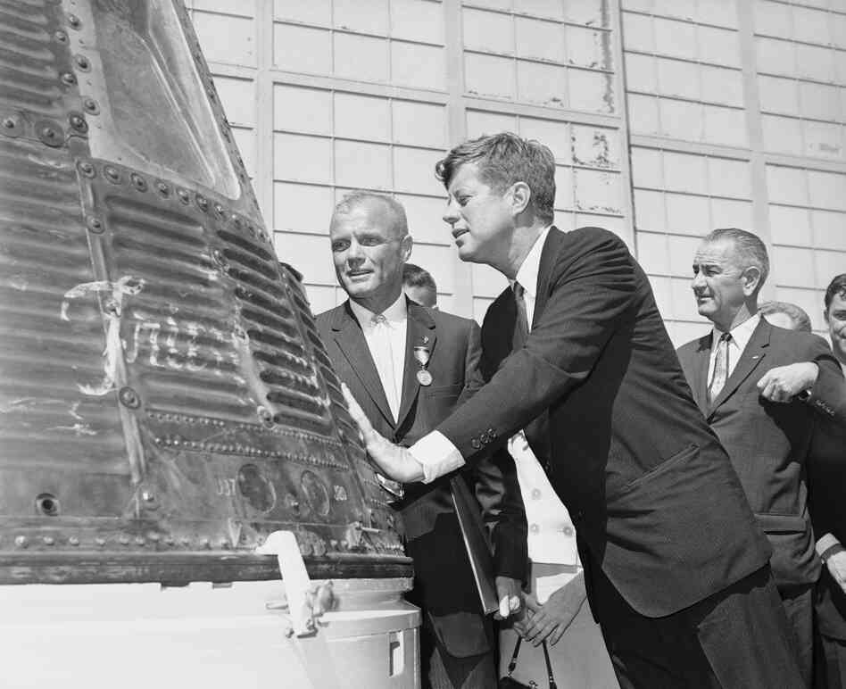 Astronaut John Glenn (left) and President John F. Kennedy inspect the Friendship 7 Mercury capsule on Feb. 23, 1962, which Glenn rode in orbit. At right is Vice President Lyndon B. Johnson. Astronaut John Glenn (left) and President John F. Kennedy inspect the Friendship 7 Mercury capsule on Feb. 23, 1962, which Glenn rode in orbit. At right is Vice President Lyndon B. Johnson.