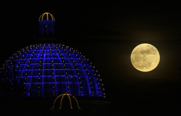 A super moon rises above a shopping center in Manchester, Britain, on March 19, 2011.