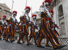 Swiss guards march prior to a swearing-in ceremony at the Vatican on Sunday. This year, 26 Swiss men are joining the oldest standing army in the world, swearing to give up their lives to protect the pope. The ceremony is held every May 6 to commemorate the day in 1527 when 147 Swiss Guards died protecting Pope Clement VII during the sack of Rome. Swiss guards march prior to a swearing-in ceremony at the Vatican on Sunday. This year, 26 Swiss men are joining the oldest standing army in the world, swearing to give up their lives to protect the pope. The ceremony is held every May 6 to commemorate the day in 1527 when 147 Swiss Guards died protecting Pope Clement VII during the sack of Rome.
