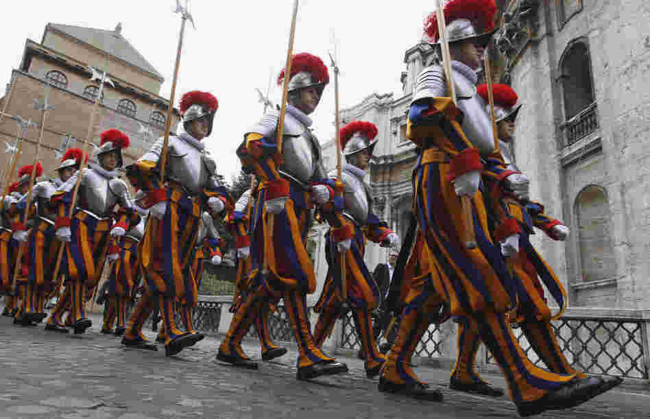 Swiss guards march prior to a swearing-in ceremony at the Vatican on Sunday. This year, 26 Swiss men are joining the oldest standing army in the world, swearing to give up their lives to protect the pope. The ceremony is held every May 6 to commemorate the day in 1527 when 147 Swiss Guards died protecting Pope Clement VII during the sack of Rome. Swiss guards march prior to a swearing-in ceremony at the Vatican on Sunday. This year, 26 Swiss men are joining the oldest standing army in the world, swearing to give up their lives to protect the pope. The ceremony is held every May 6 to commemorate the day in 1527 when 147 Swiss Guards died protecting Pope Clement VII during the sack of Rome.