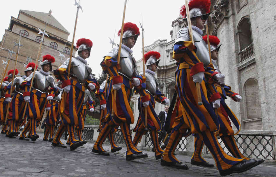 Swiss guards march prior to a swearing-in ceremony at the Vatican on Sunday. This year, 26 Swiss men are joining the oldest standing army in the world, swearing to give up their lives to protect the pope. The ceremony is held every May 6 to commemorate the day in 1527 when 147 Swiss Guards died protecting Pope Clement VII during the sack of Rome. Swiss guards march prior to a swearing-in ceremony at the Vatican on Sunday. This year, 26 Swiss men are joining the oldest standing army in the world, swearing to give up their lives to protect the pope. The ceremony is held every May 6 to commemorate the day in 1527 when 147 Swiss Guards died protecting Pope Clement VII during the sack of Rome.