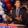 Barack Obama, then a Democratic candidate for a U.S. House seat, delivers his concession speech to supporters, while his wife, Michelle, tends to their daughter, Malia, on March 21, 2000, in Chicago.