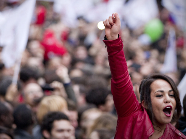 In Paris on Sunday, supporters of newly elected president Francois Hollande celebrated.