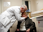 AnnaBelle Bowers' long-time physician, Walter Watkin, gives her a kiss on the forehead at the end of her visit. When asked how long she had been coming to see him, he said, "Long enough for her file to be 2 inches thick." AnnaBelle Bowers' long-time physician, Walter Watkin, gives her a kiss on the forehead at the end of her visit. When asked how long she had been coming to see him, he said, "Long enough for her file to be 2 inches thick."
