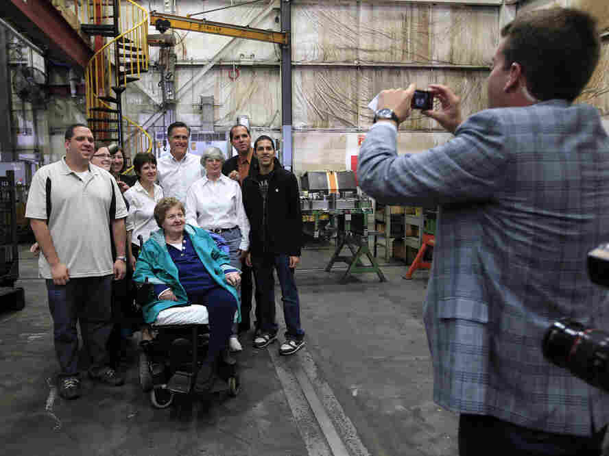 Mitt Romney poses with a group of supporters at a Euclid, OH town hall-style meeting where some voters didn't exactly help him keep to his themes. Mitt Romney poses with a group of supporters at a Euclid, OH town hall-style meeting where some voters didn't exactly help him keep to his themes.