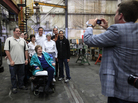 Mitt Romney poses with a group of supporters at a Euclid, OH town hall-style meeting where some voters didn't exactly help him keep to his themes. Mitt Romney poses with a group of supporters at a Euclid, OH town hall-style meeting where some voters didn't exactly help him keep to his themes.