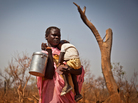 A displaced woman and her child from the Nuba Mountains in Sudan wait outside the Yida refugee camp registration center in Yida, South Sudan April 26. Thousands of people from the Nuba Mountains in South Kordofan, Sudan have fled to Yida to escape recent fighting and airstrikes by Sudan's Armed Forces. A displaced woman and her child from the Nuba Mountains in Sudan wait outside the Yida refugee camp registration center in Yida, South Sudan April 26. Thousands of people from the Nuba Mountains in South Kordofan, Sudan have fled to Yida to escape recent fighting and airstrikes by Sudan's Armed Forces.