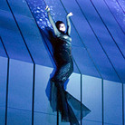 Rheinmaidens dangle from the $16 million set in the Met's production of Wagner's Ring cycle. Rheinmaidens dangle from the $16 million set in the Met's production of Wagner's Ring cycle.