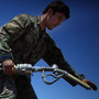 U.S. troops are training Afghan soldiers to take more responsibility in the war against the Taliban. But the Afghans still depend heavily on the Americans. Here, an Afghan solider fills up gas cans with diesel fuel from a U.S. Army tanker in southern Afghanistan.