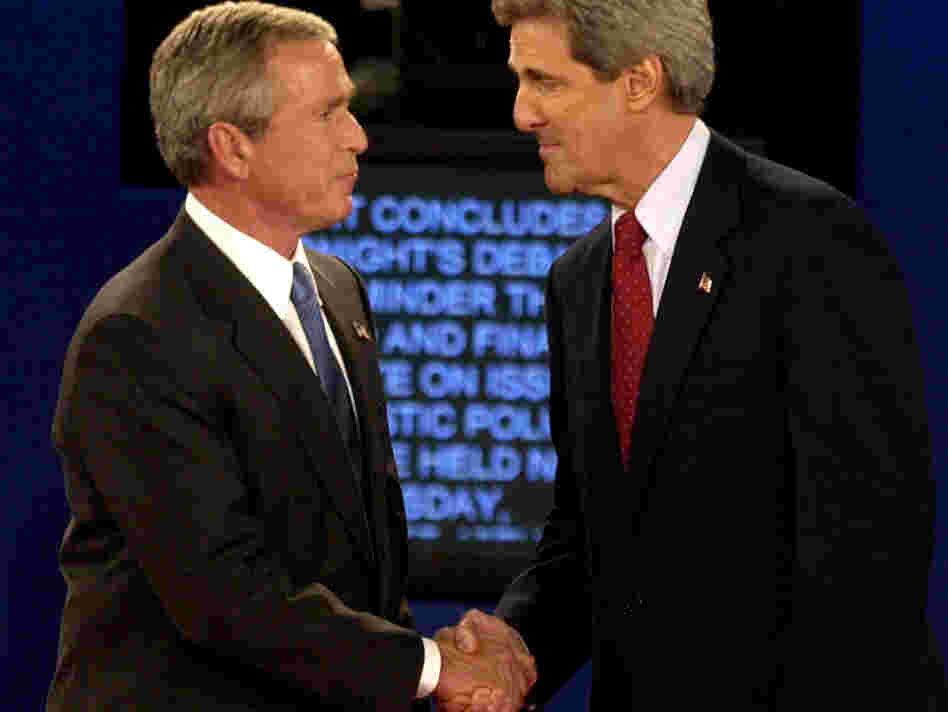 President Bush and then-Democratic presidential nominee John Kerry shake hands at the end of a presidential debate in 2004 in St. Louis. Researchers want to better understand why partisans' views of the facts change in light of their political loyalties.