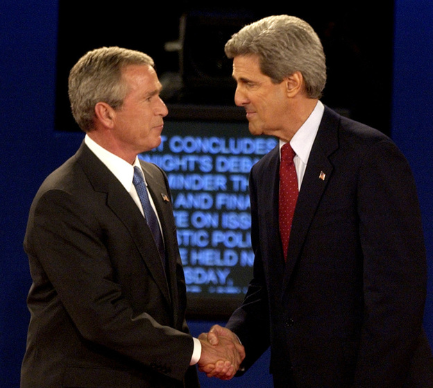 President Bush and then-Democratic presidential nominee John Kerry shake hands at the end of a presidential debate in 2004 in St. Louis. Researchers want to better understand why partisans' views of the facts change in light of their political loyalties.