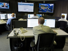 Cybersecurity analysts work in the watch and warning center during the first tour of the government's secretive cyberdefense lab intended to protect the nation's power, water and chemical plants, electrical grid and other facilities on Sept. 29, 2011, in Idaho Falls, Idaho. Cybersecurity analysts work in the watch and warning center during the first tour of the government's secretive cyberdefense lab intended to protect the nation's power, water and chemical plants, electrical grid and other facilities on Sept. 29, 2011, in Idaho Falls, Idaho.