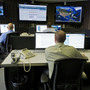 Cybersecurity analysts work in the watch and warning center during the first tour of the government's secretive cyberdefense lab intended to protect the nation's power, water and chemical plants, electrical grid and other facilities on Sept. 29, 2011, in Idaho Falls, Idaho.
