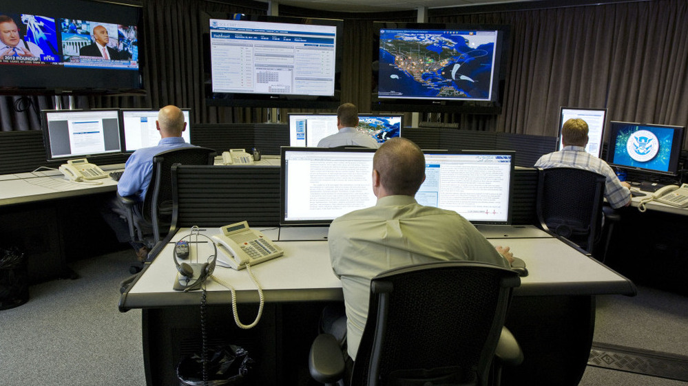 Cybersecurity analysts work in the watch and warning center during the first tour of the government's secretive cyberdefense lab intended to protect the nation's power, water and chemical plants, electrical grid and other facilities on Sept. 29, 2011, in Idaho Falls, Idaho.