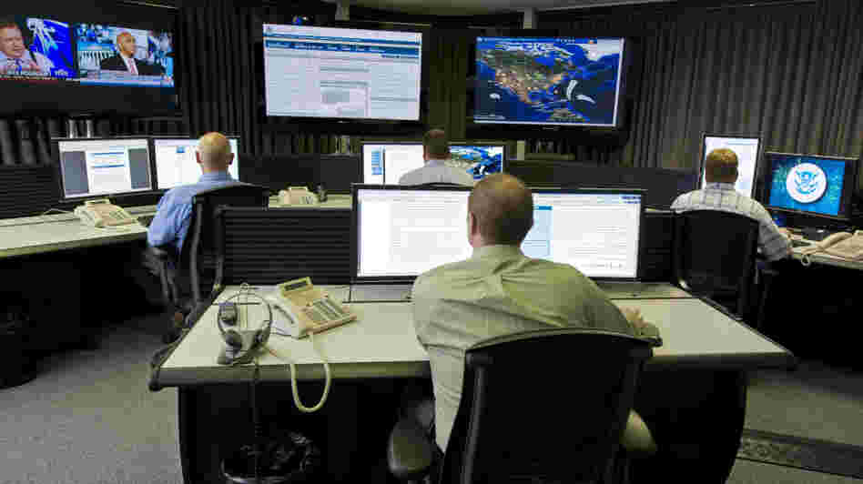 Cybersecurity analysts work in the watch and warning center during the first tour of the government's secretive cyberdefense lab intended to protect the nation's power, water and chemical plants, electrical grid and other facilities on Sept. 29, 2011, in Idaho Falls, Idaho.
