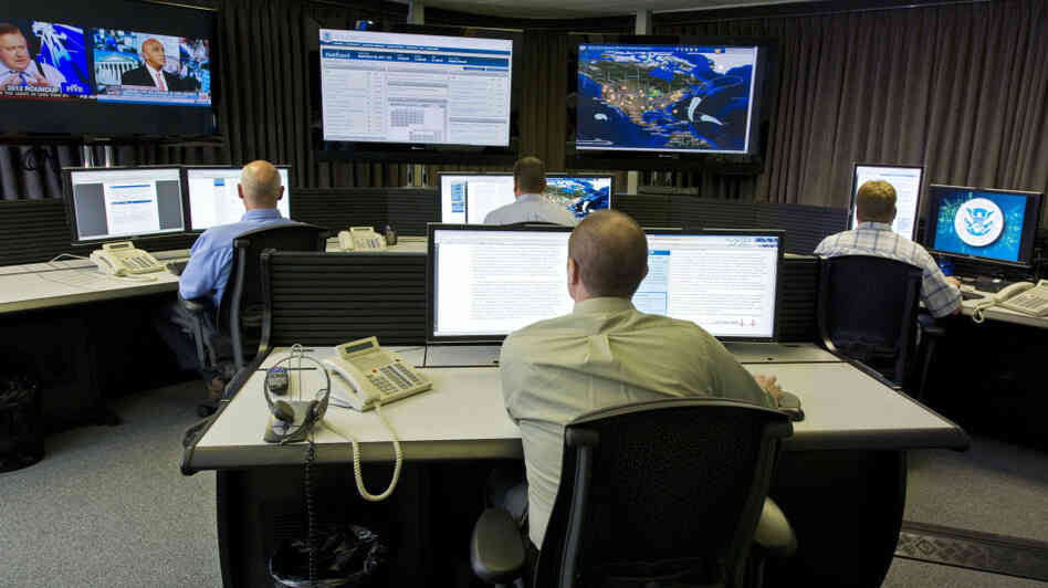 Cybersecurity analysts work in the watch and warning center during the first tour of the government's secretive cyberdefense lab intended to protect the nation's power, water and chemical plants, electrical grid and other facilities on Sept. 29, 2011, in Idaho Falls, Idaho.