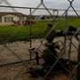 A working gas well head is fenced in just opposite of a home in Dish, Texas. Dish is about 30 miles north of Fort Worth.