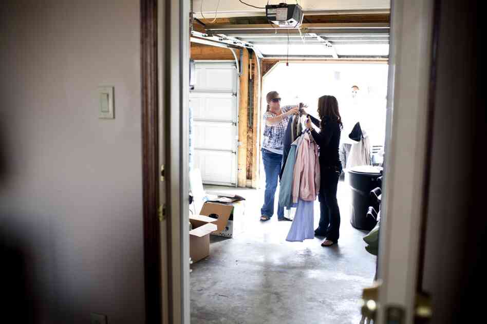 LaDonna hands AnnaBelle's clothes to Kelley. "I'm hoping my daughters see how we are taking care of Snootzie and treat me the same way," says Kelley.