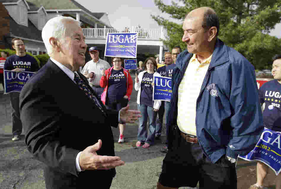 Sen. Richard Lugar talks with Joe Purichia before voting on Tuesday in Greenwood, Ind.